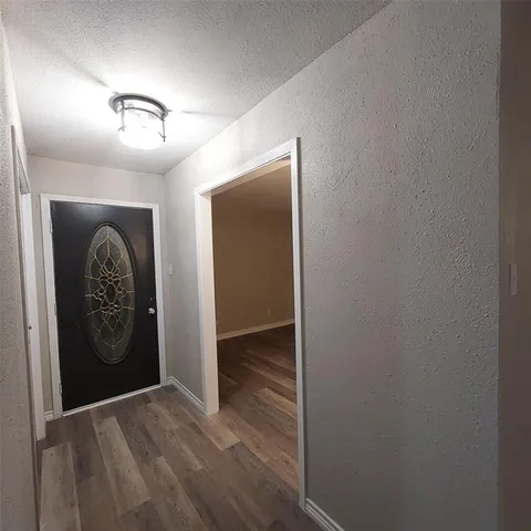 a view of a hallway with closet