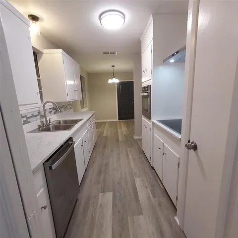 a large bathroom with a sink a vanity and a mirror