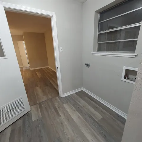 a view of an empty room with closet