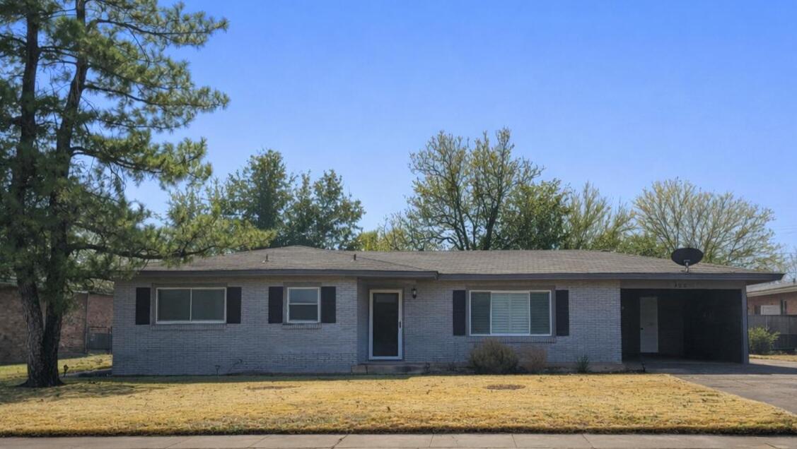 305 North 21st Street Lamesa, TX 79331 - Photo 1 of 23 a front view of a house with a yard