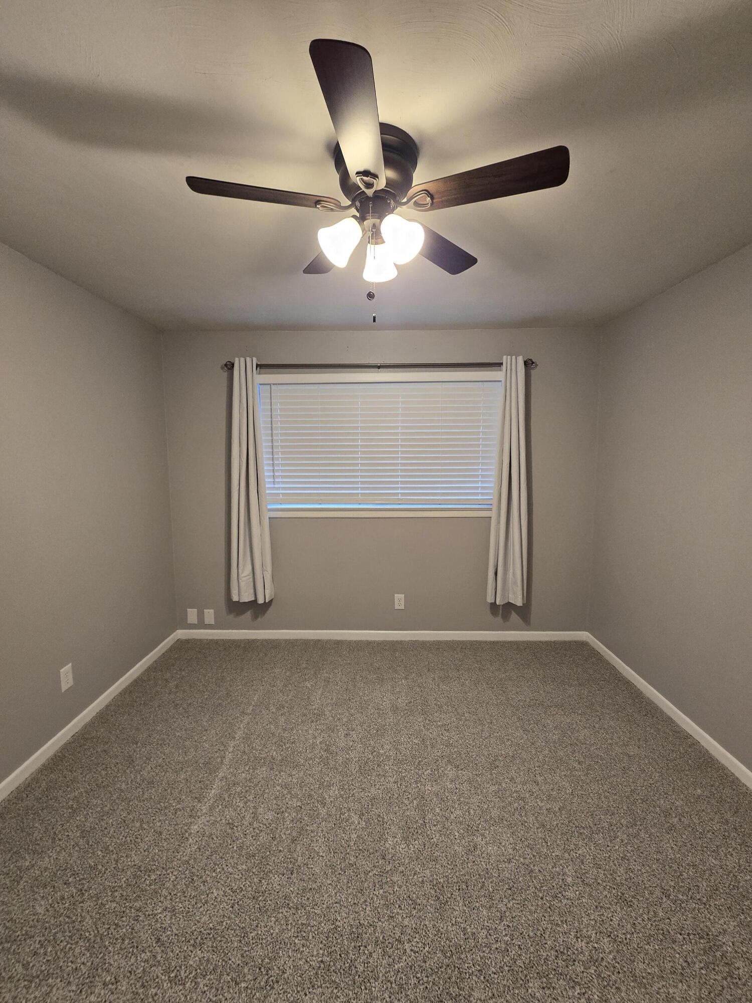 305 North 21st Street Lamesa, TX 79331 - Photo 12 of 23 a view of an empty room with a window