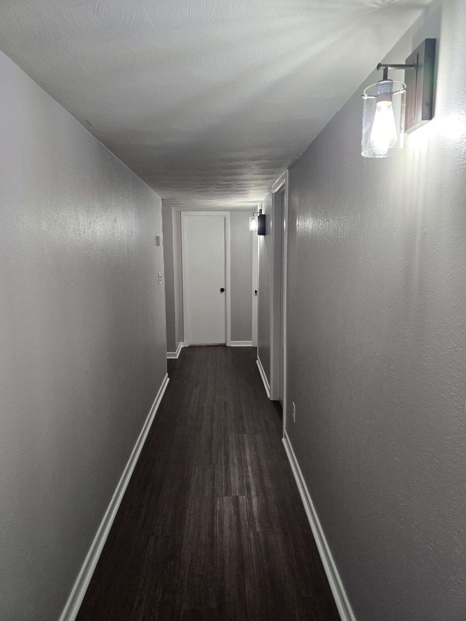 305 North 21st Street Lamesa, TX 79331 - Photo 17 of 23 a view of a hallway with wooden floor