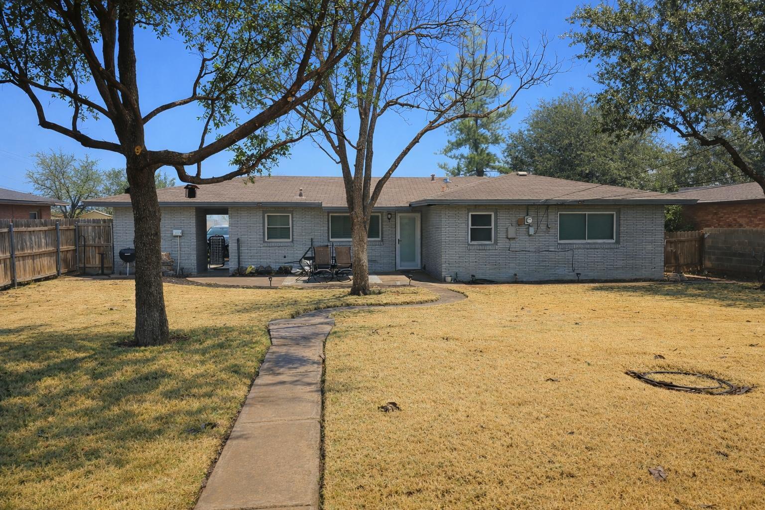 305 North 21st Street Lamesa, TX 79331 - Photo 20 of 23 a house view with swimming pool in front of house
