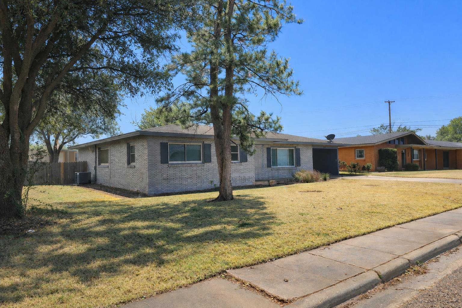 305 North 21st Street Lamesa, TX 79331 - Photo 23 of 23 a front view of a house with a yard