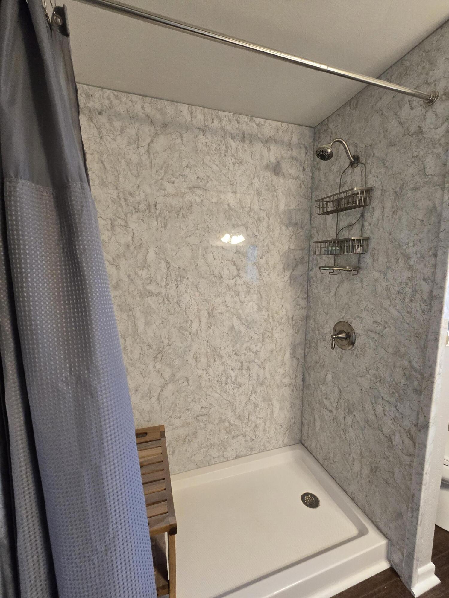 305 North 21st Street Lamesa, TX 79331 - Photo 10 of 23 a bathroom with a shower and a bath tub