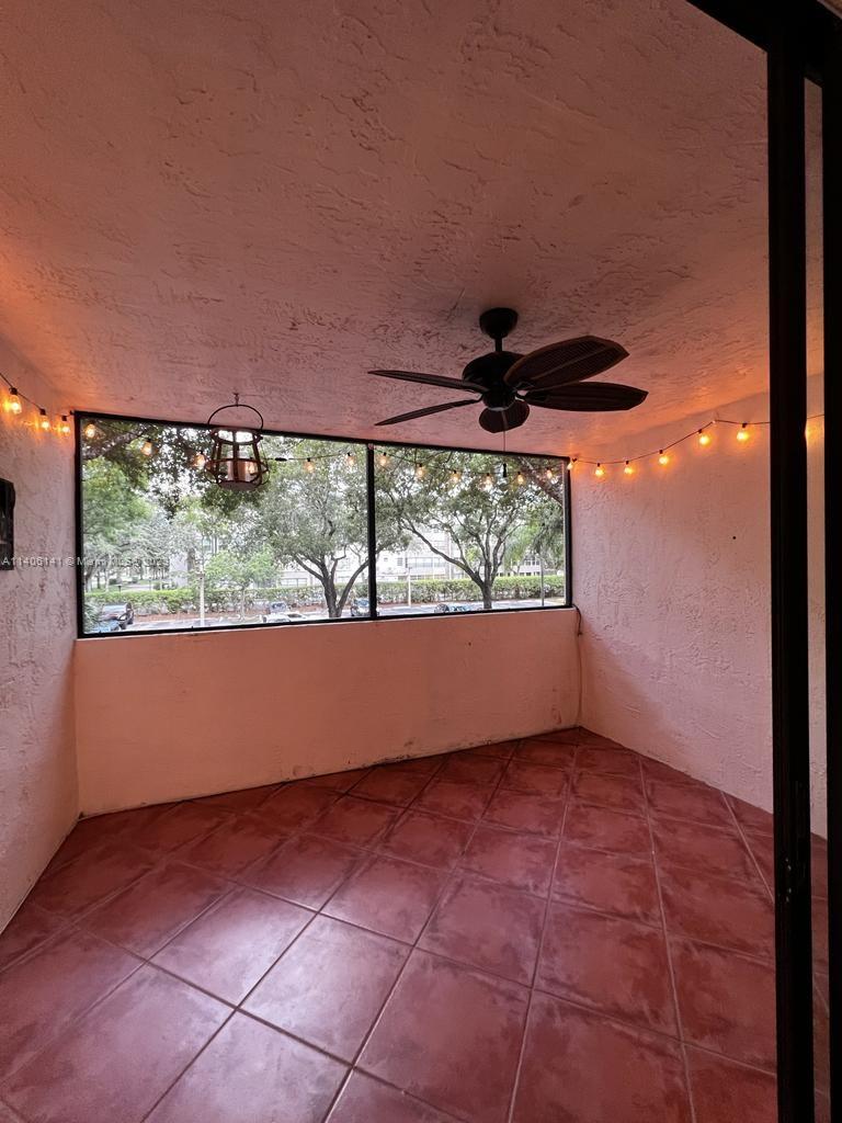 6800 Cypress Road, Unit 211 Plantation, FL 33317 - Photo 4 of 19 a view of an empty room with a window