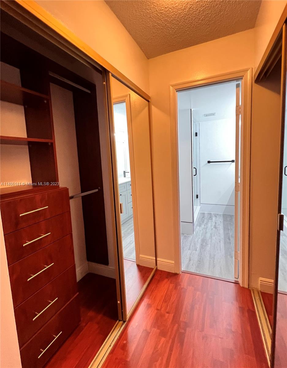 6800 Cypress Road, Unit 211 Plantation, FL 33317 - Photo 9 of 19 a view of closet with wooden floor