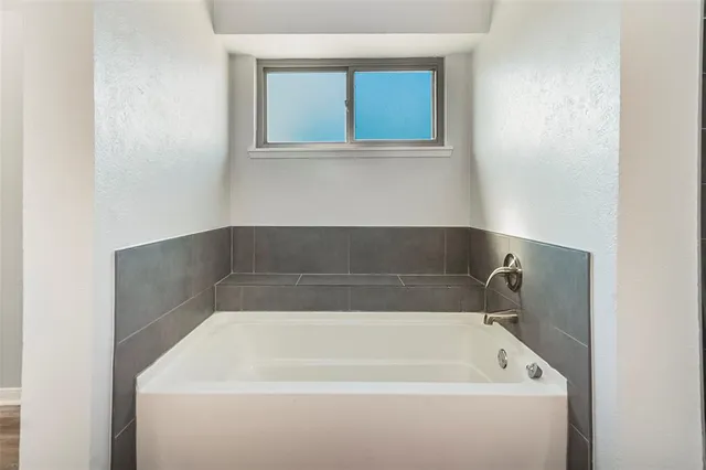 a bathroom with a bathtub