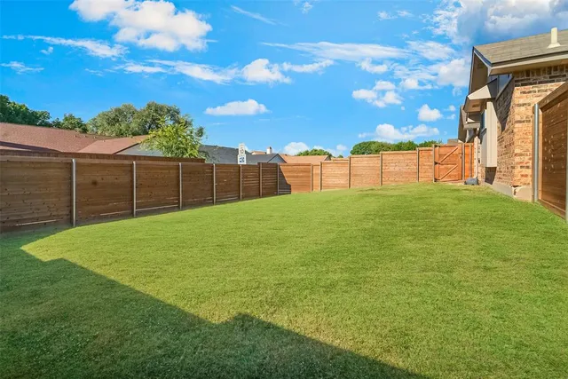 a view of a backyard with a garden