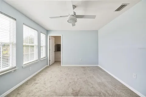 a bathroom with a granite countertop sink a large mirror and a shower