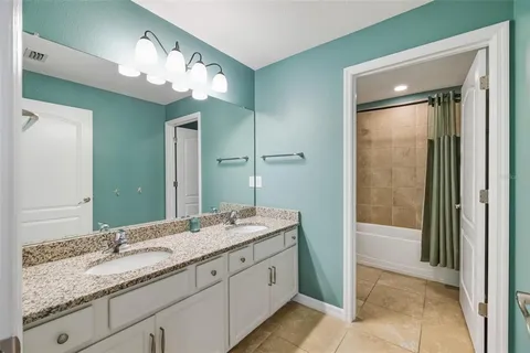 a view of swimming pool with a patio