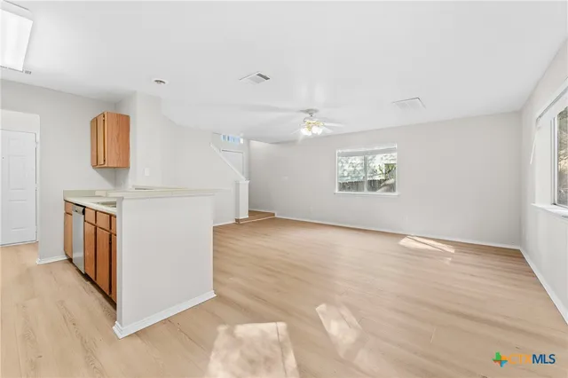 a view of a kitchen with a sink dishwasher and a microwave