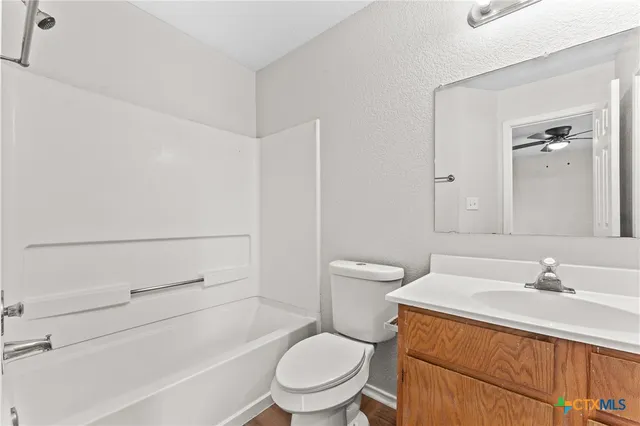 a bathroom with a sink a toilet and a bathtub