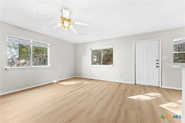 a view of an empty room with a window