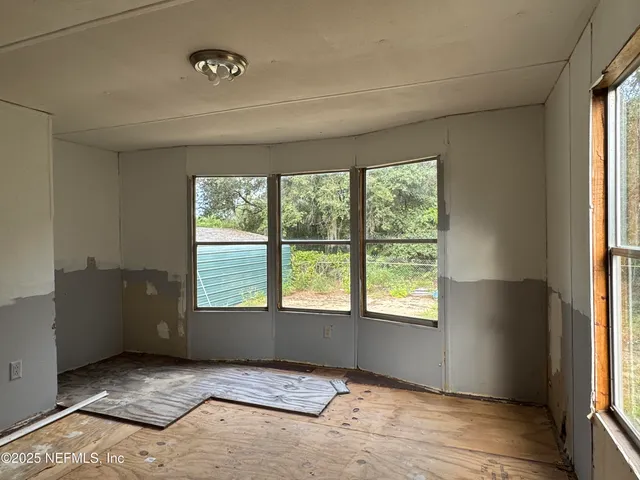 a view of an empty room and window