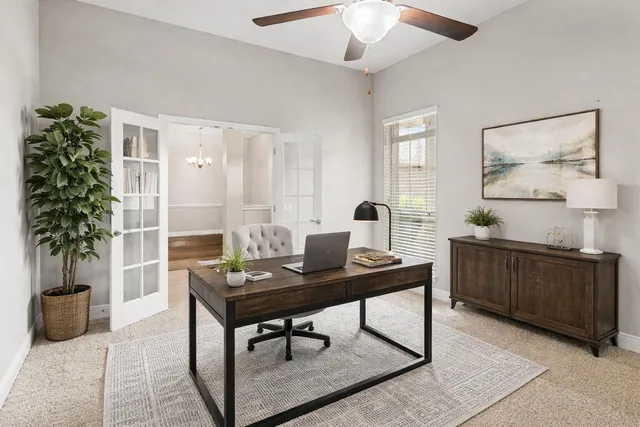 a bathroom with a granite countertop sink mirror and double