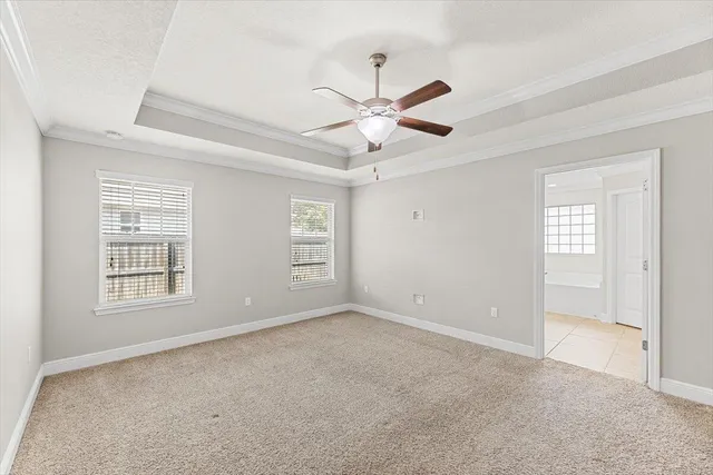 a bathroom with a granite countertop sink toilet mirror and shower