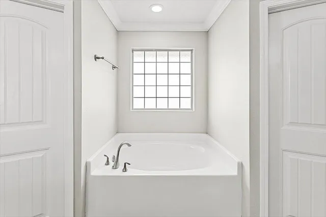 a front view of a house with swimming pool having outdoor seating