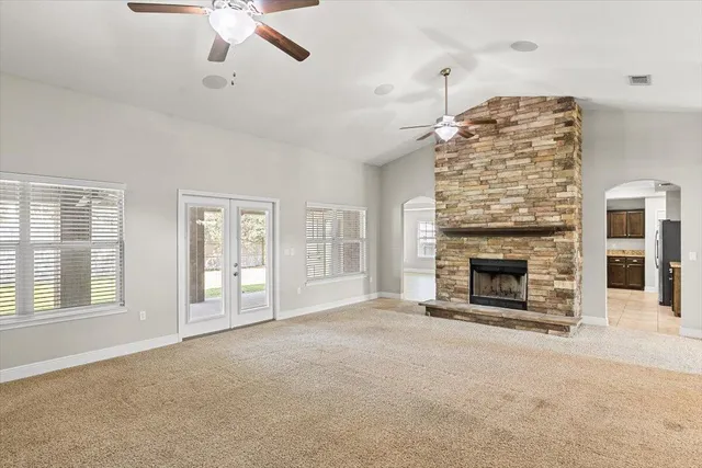 a view of a dining room with furniture and windows