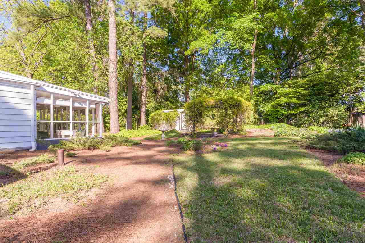 1306 Courtland Drive Raleigh, NC 27604 - Photo 18 of 22 Honestly, the photos don't do it justice. It's .29 acres -- a lot and a half. Look closely and you can catch a glimpse of the wired storage shed in the opposite corner of the yard.