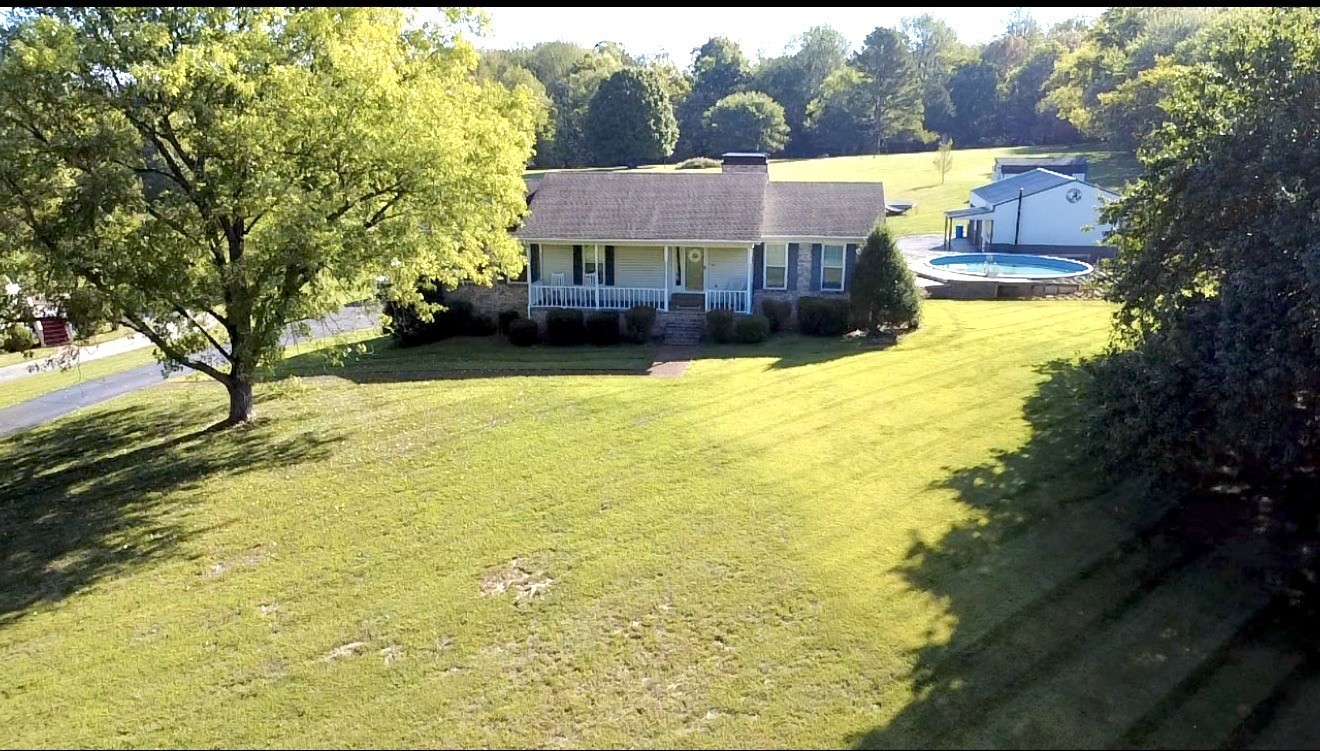 356 Lee Road Cottontown, TN 37048 - Photo 52 of 52 a view of swimming pool with an outdoor space and seating area