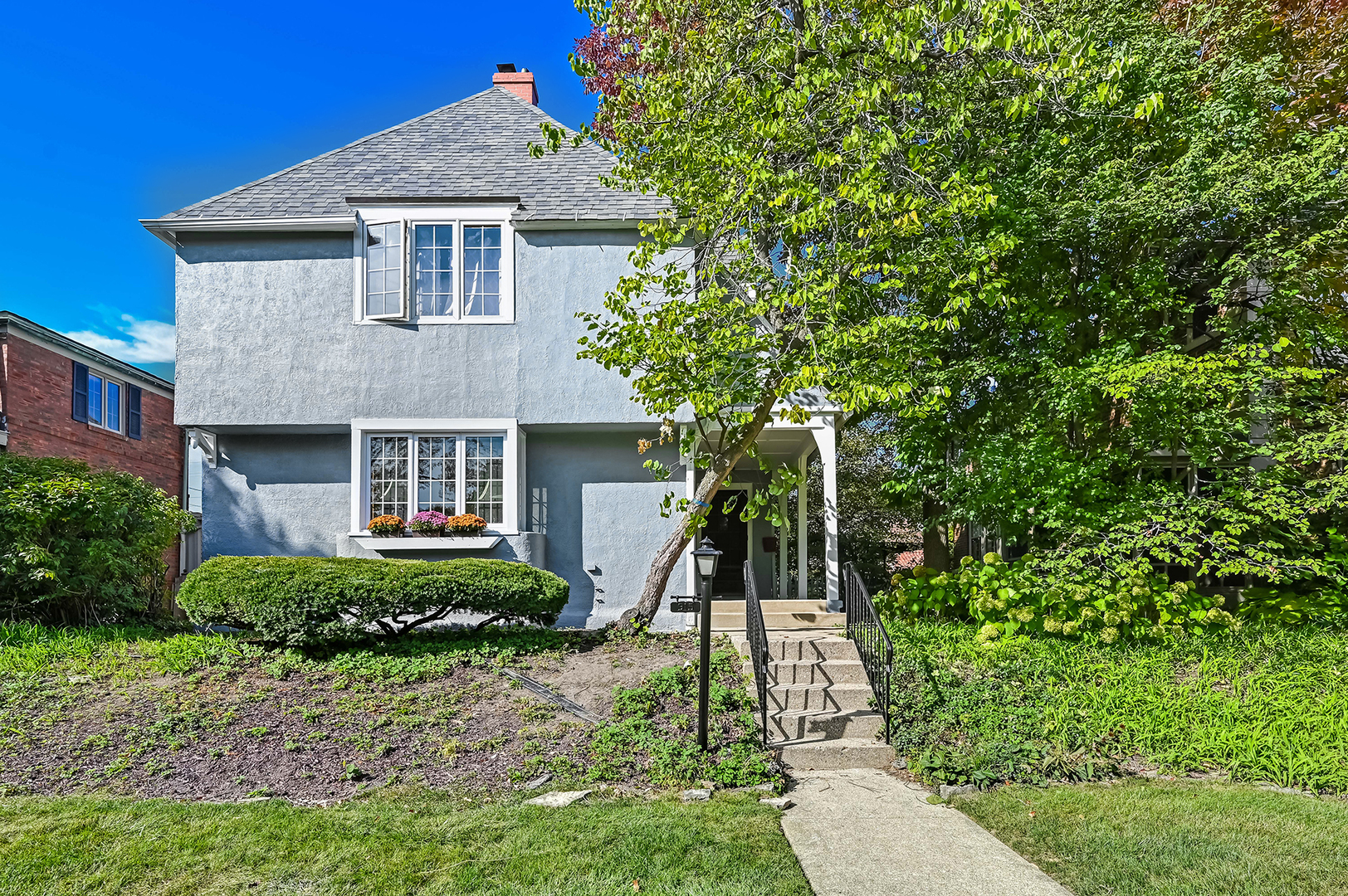 a front view of a house with a yard