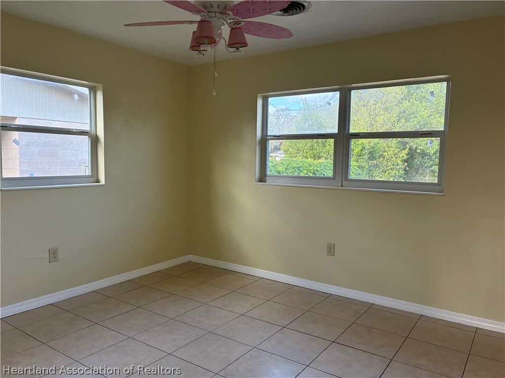 1525 Lagrange Avenue Sebring, FL 33870 - Photo 11 of 16 an empty room with a window