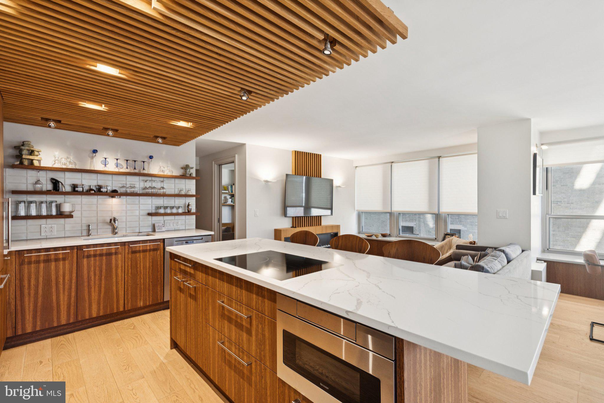 224 West Rittenhouse Square, Unit 1105 Philadelphia, PA 19103 - Photo 31 of 46 Sleek modern kitchen with warm accents.