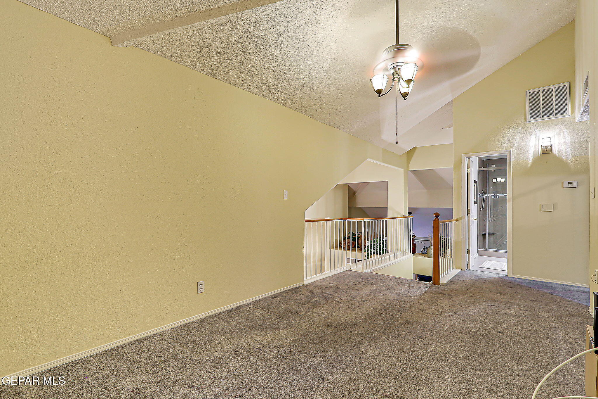 6745 Isla Del Rey Drive El Paso, TX 79912 - Photo 27 of 37 a view of a livingroom with a furniture and chandelier
