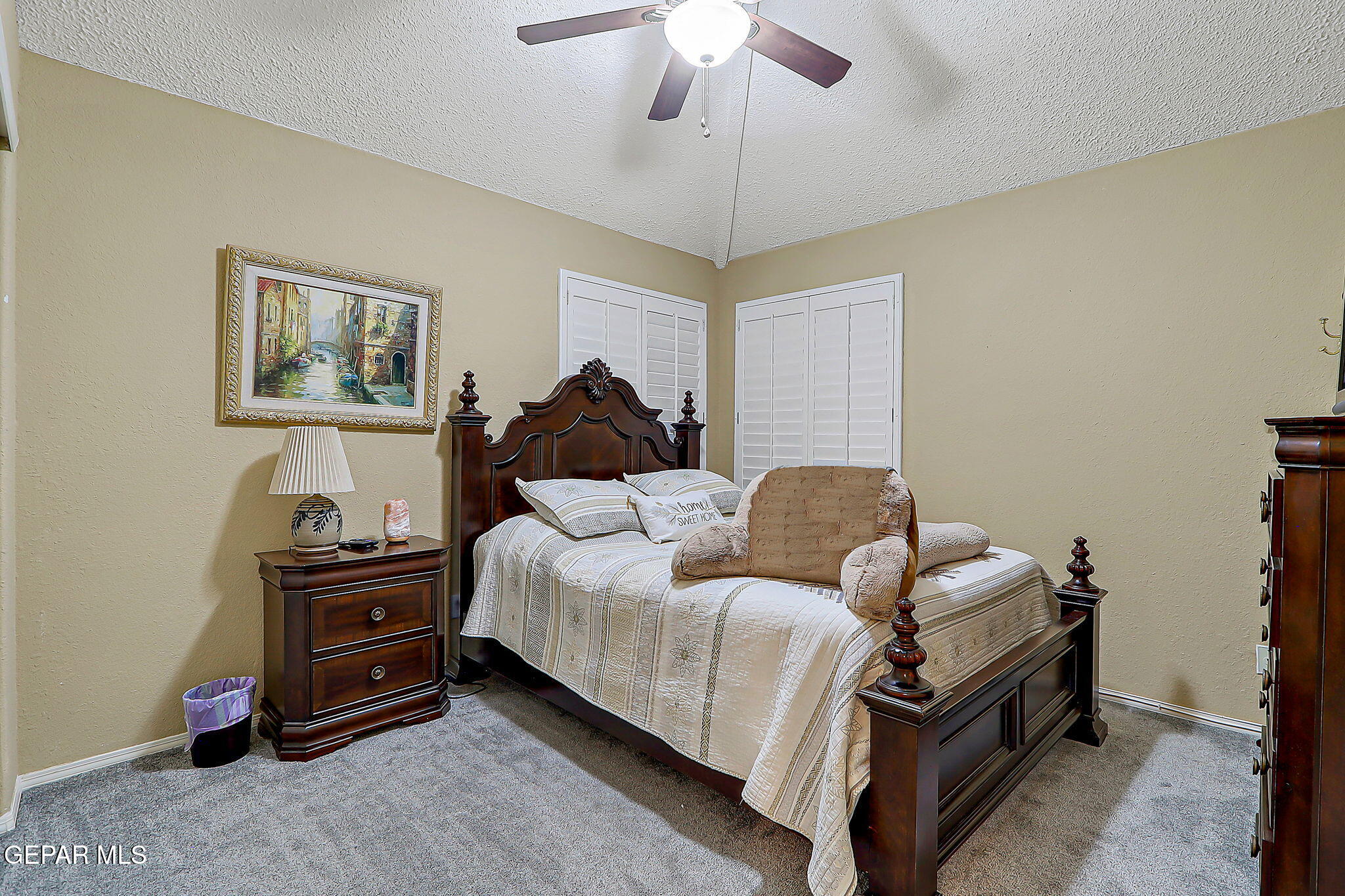 6745 Isla Del Rey Drive El Paso, TX 79912 - Photo 28 of 37 a bedroom with a bed and a chandelier