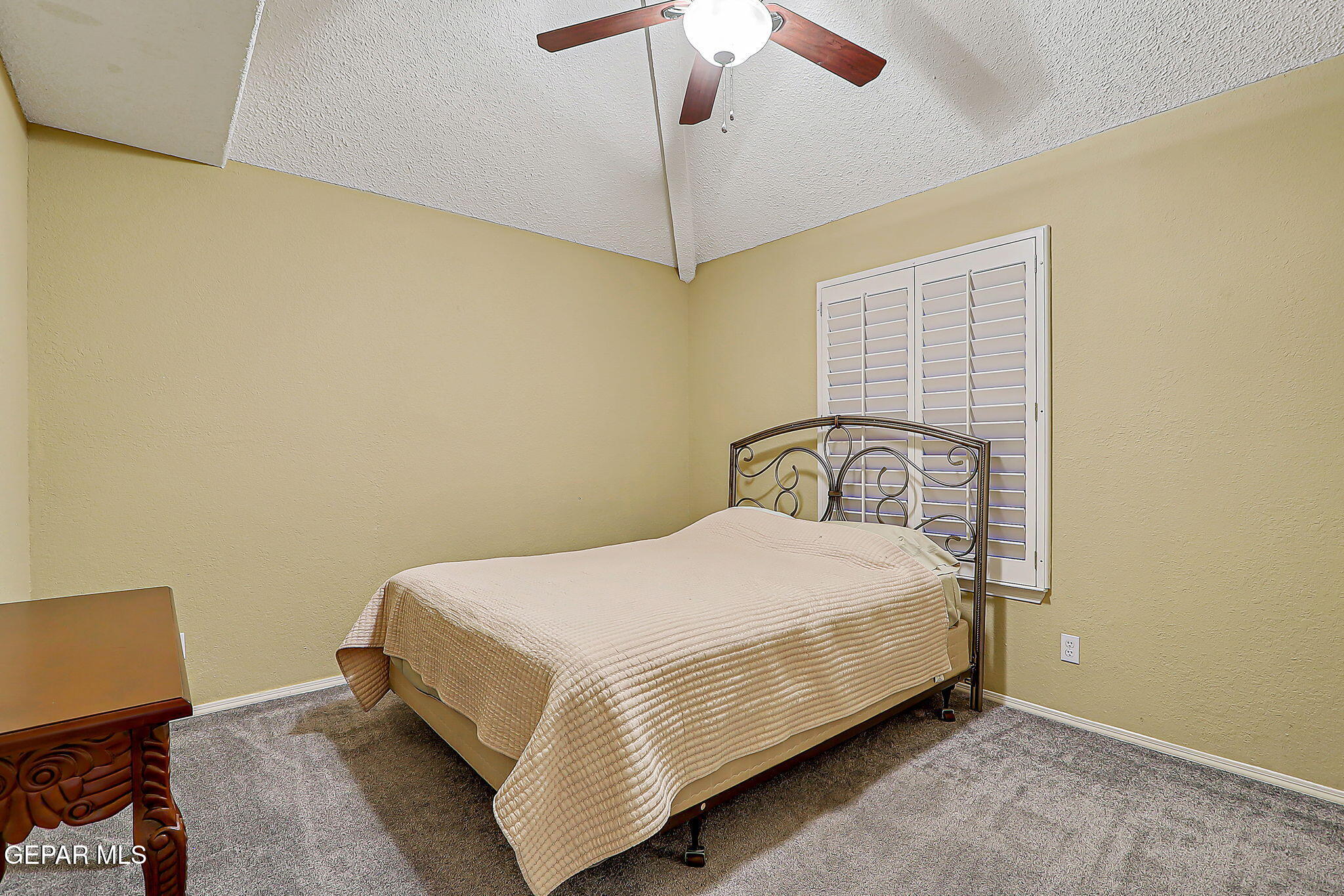 6745 Isla Del Rey Drive El Paso, TX 79912 - Photo 29 of 37 a bedroom with a bed and a chandelier