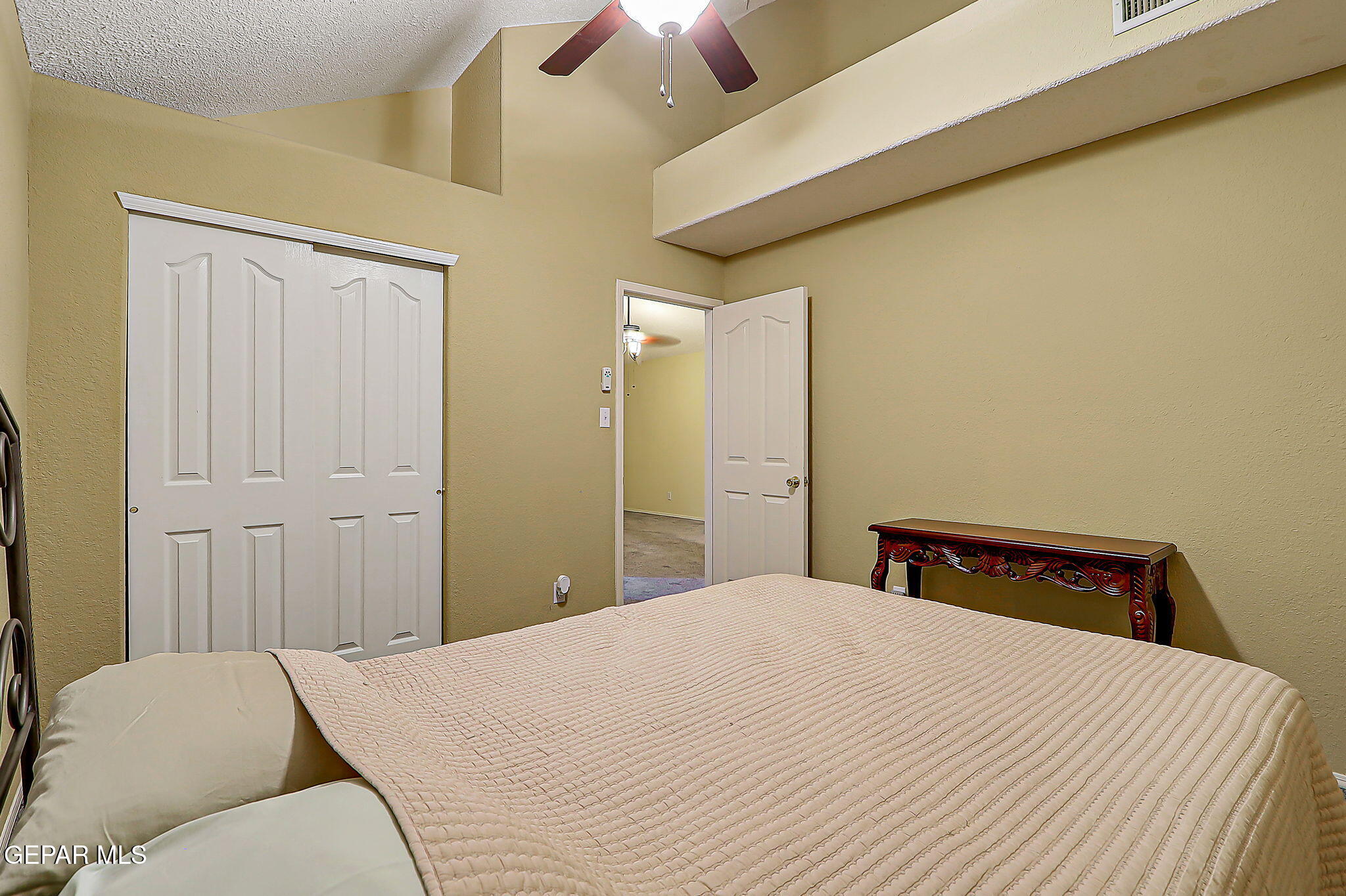 6745 Isla Del Rey Drive El Paso, TX 79912 - Photo 30 of 37 a bedroom with a bed and a lamp