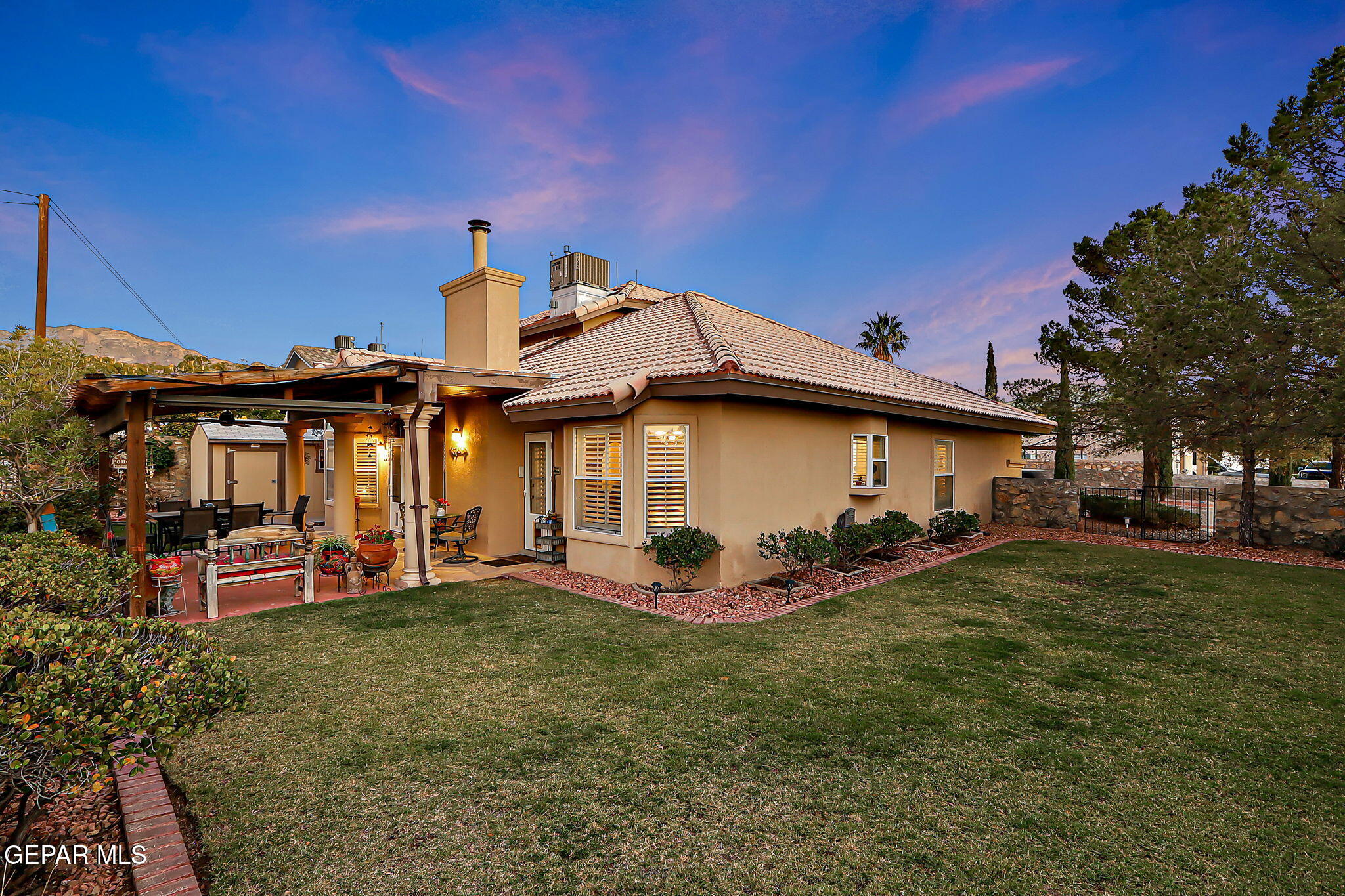 6745 Isla Del Rey Drive El Paso, TX 79912 - Photo 35 of 37 a front view of a house with garden