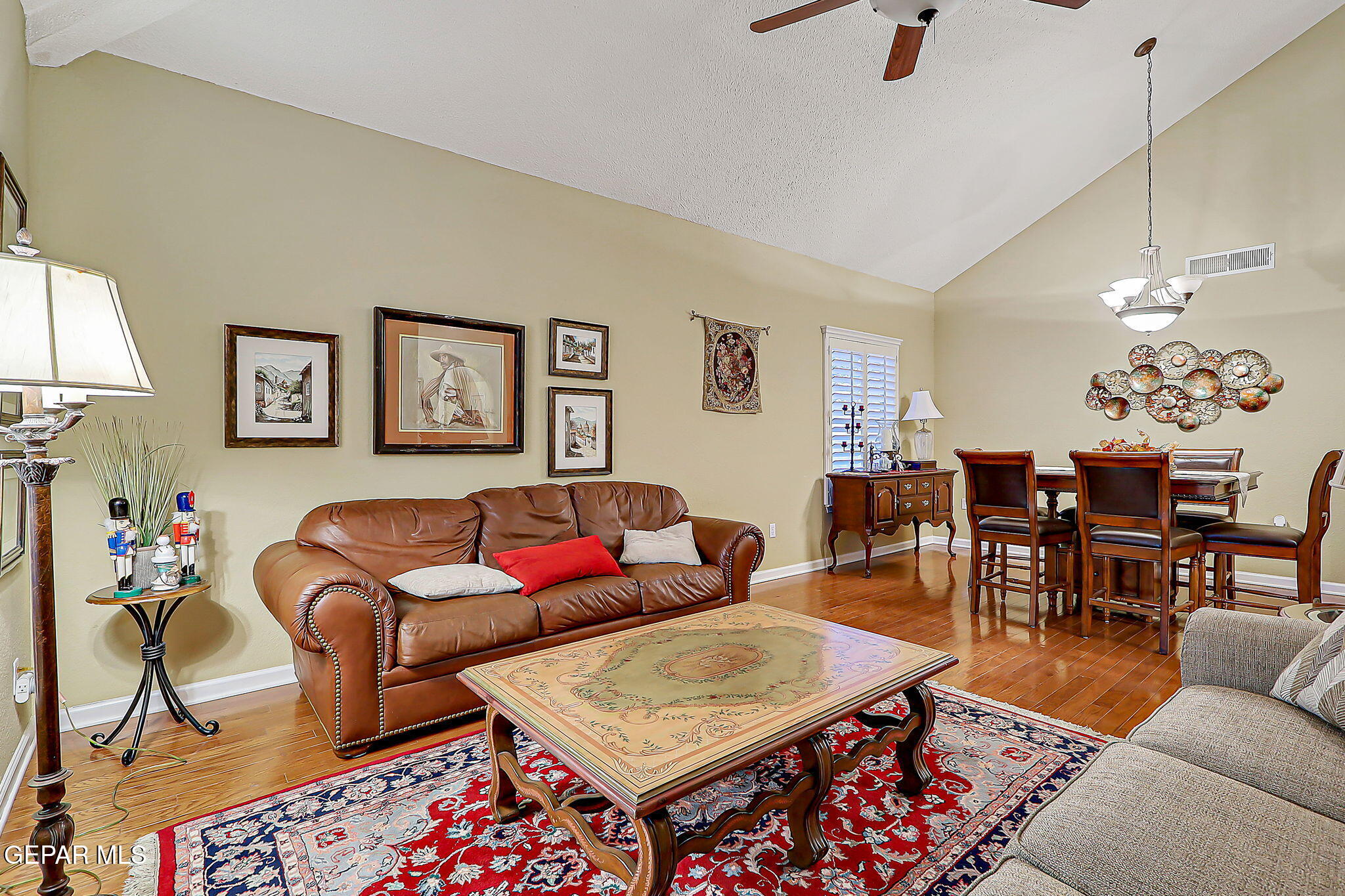 6745 Isla Del Rey Drive El Paso, TX 79912 - Photo 5 of 37 a living room with furniture and a dining table