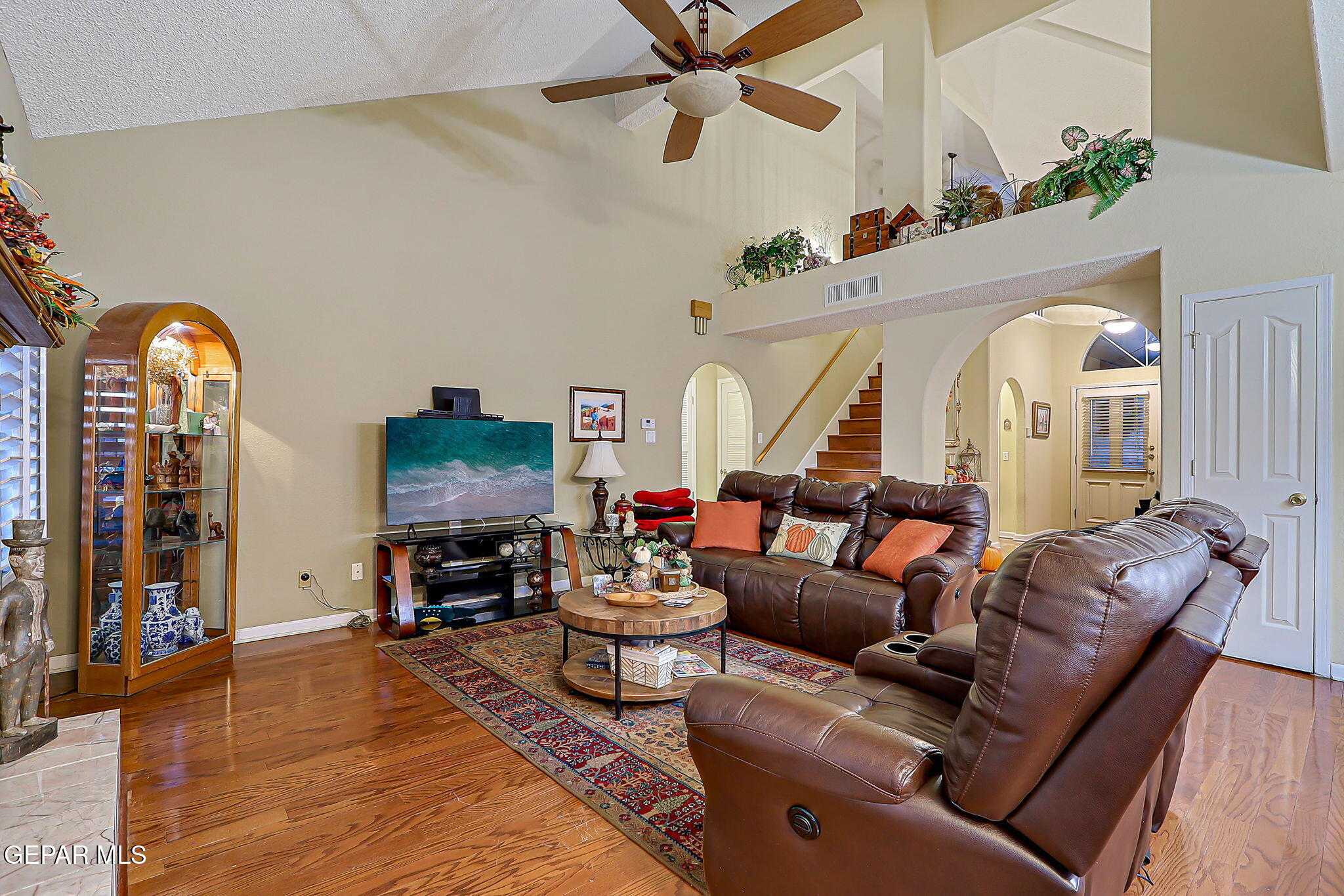6745 Isla Del Rey Drive El Paso, TX 79912 - Photo 10 of 37 a living room with furniture and wooden floor