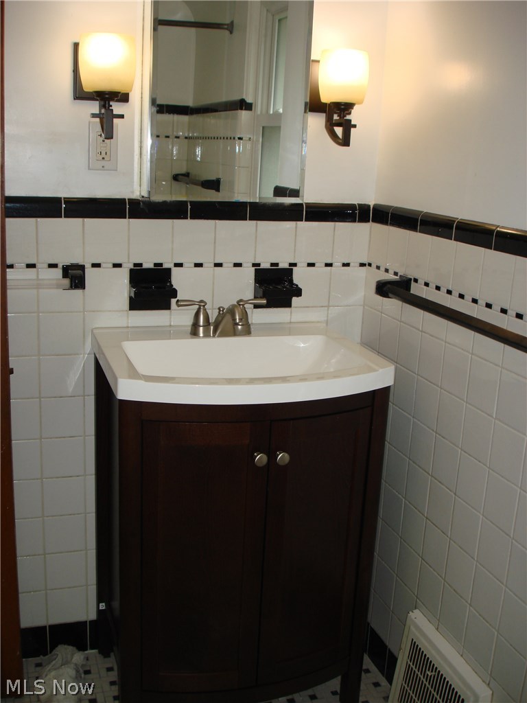 18027 Nottingham Road Cleveland, OH 44119 - Photo 14 of 34 Updated bathroom still has the old charm and character of old, nice blend of old and new styles!