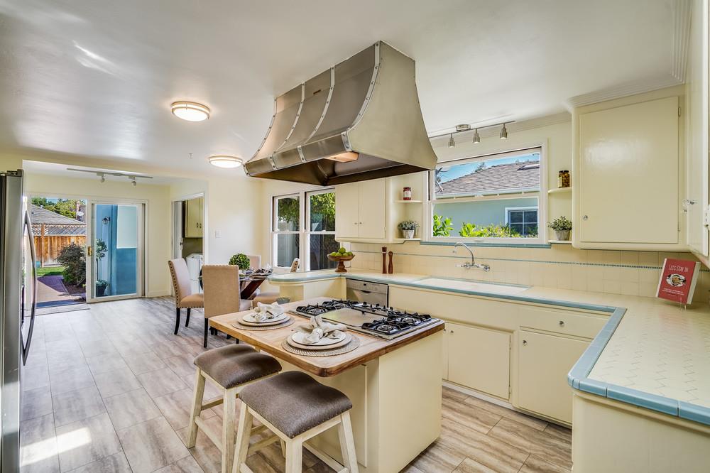 McDaniel Avenue San Jose, CA 95126 - Photo 23 of 54 a kitchen with a dining table and chairs