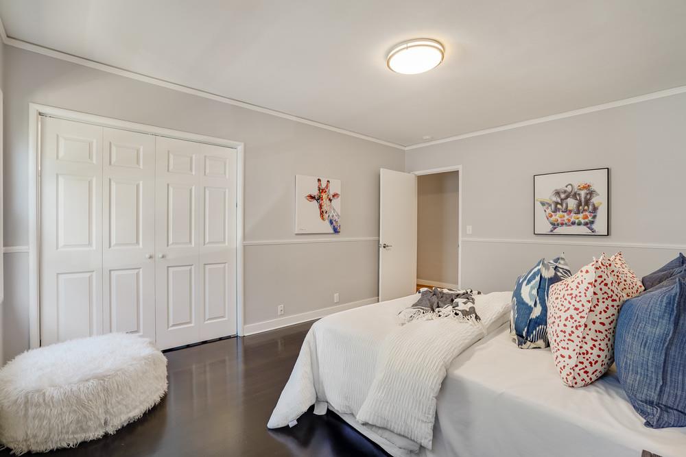 McDaniel Avenue San Jose, CA 95126 - Photo 30 of 54 a bedroom with a bed and a painting on the wall