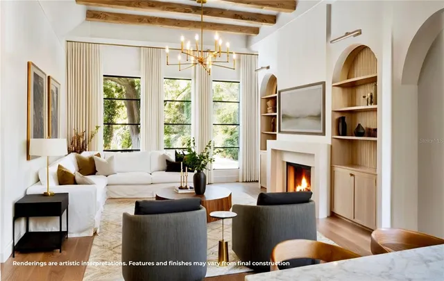 a living room with furniture fireplace and a large window