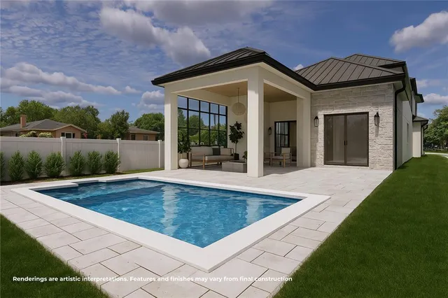 a view of a house with a swimming pool and a yard