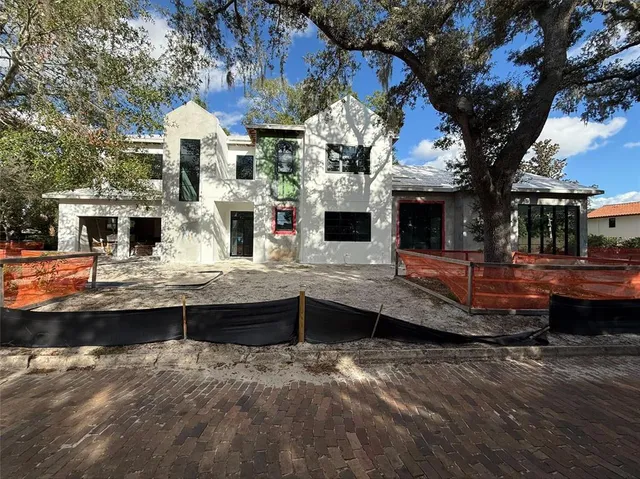 a view of multiple houses with a swimming pool