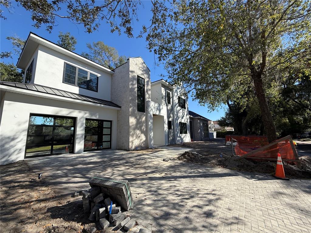 1910 Glencoe Road Winter Park, FL 32789 - Photo 10 of 12 a view of a house with snow on the side of the road