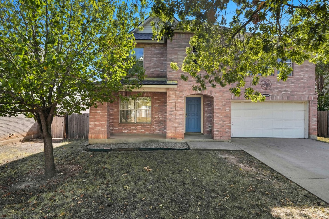 1312 Rosie Lane Cedar Park, TX 78613 - Photo 1 of 38 a front view of a house with a yard and a garage