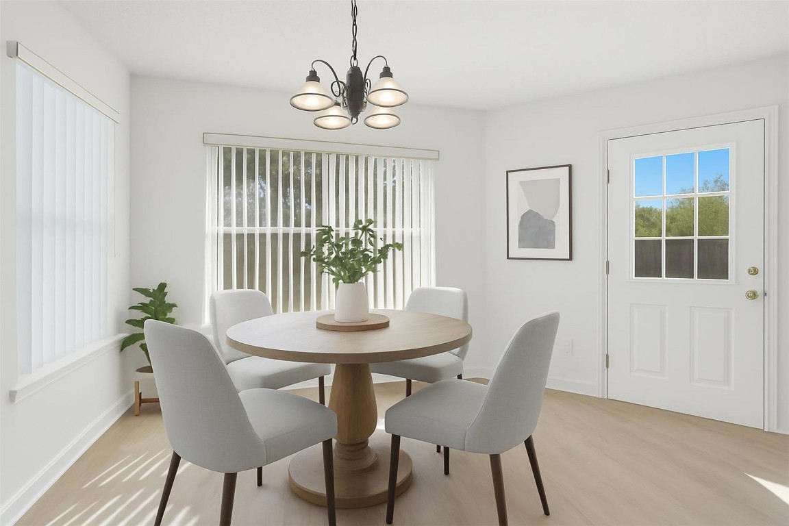 1312 Rosie Lane Cedar Park, TX 78613 - Photo 12 of 38 a view of a dining room with furniture window and wooden floor