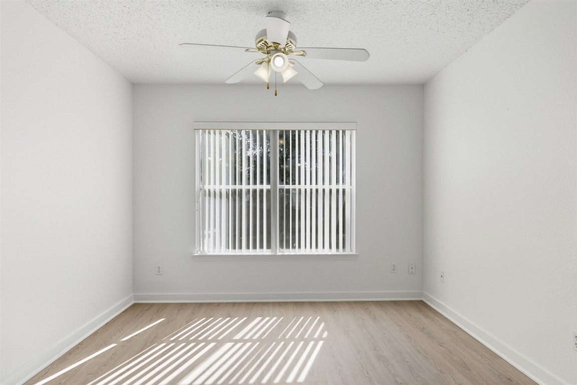 1312 Rosie Lane Cedar Park, TX 78613 - Photo 14 of 38 a view of an empty room with a window