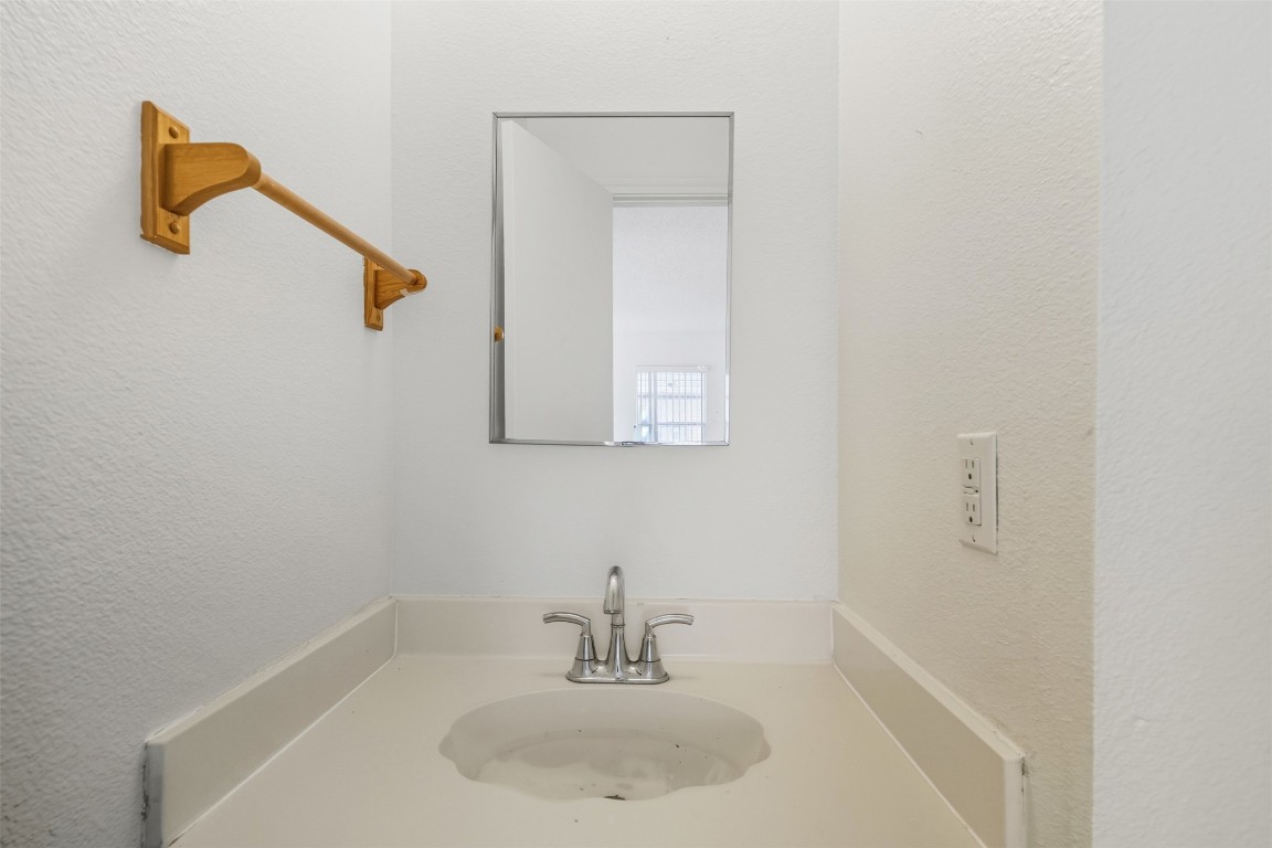 1312 Rosie Lane Cedar Park, TX 78613 - Photo 22 of 38 a bathroom with a sink and mirror