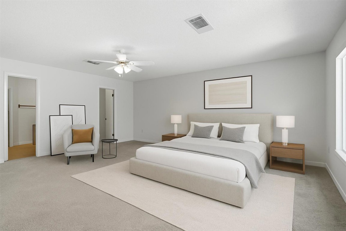 1312 Rosie Lane Cedar Park, TX 78613 - Photo 23 of 38 a bedroom with a bed and a chandelier