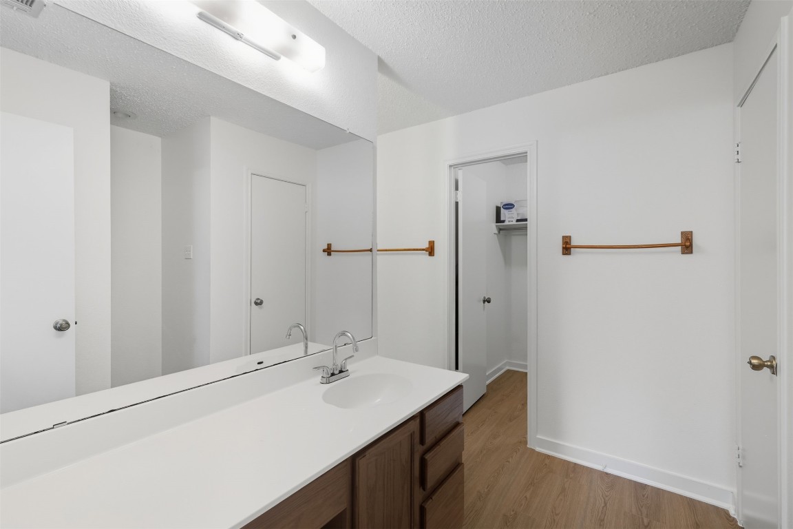 1312 Rosie Lane Cedar Park, TX 78613 - Photo 28 of 38 a bathroom with a sink a mirror and a bathtub
