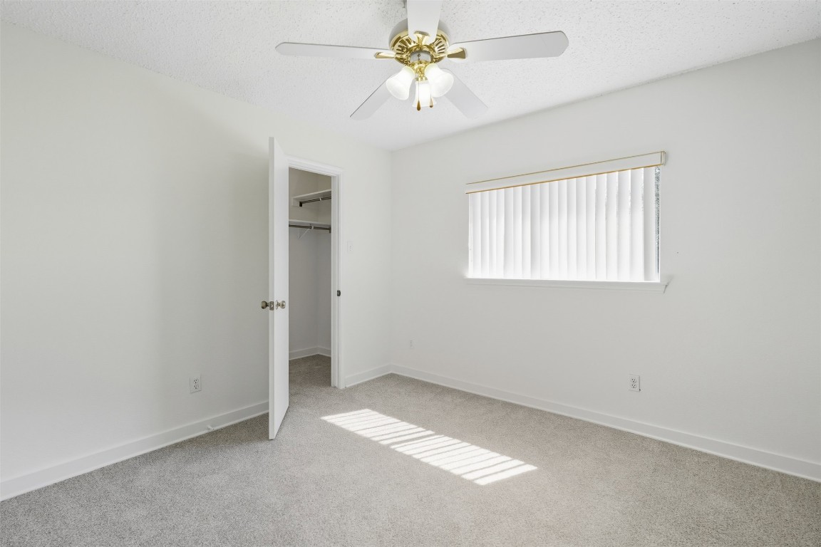 1312 Rosie Lane Cedar Park, TX 78613 - Photo 33 of 38 an empty room with a window and a fan