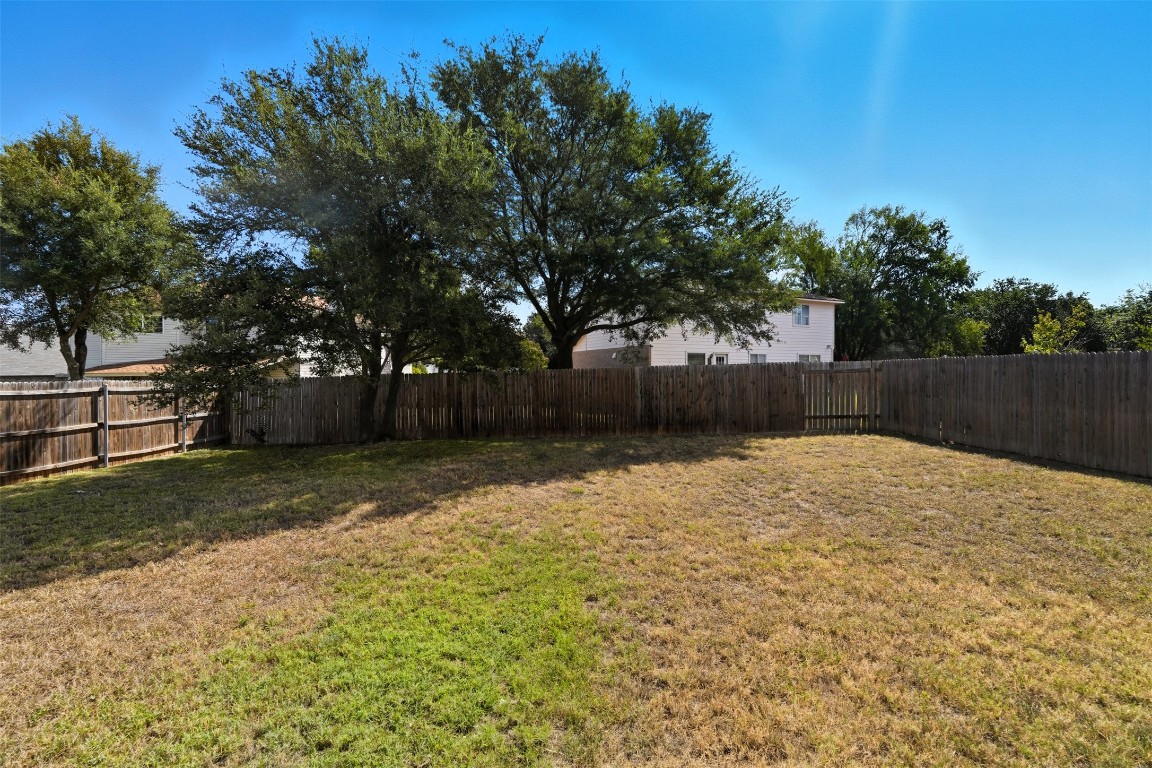 1312 Rosie Lane Cedar Park, TX 78613 - Photo 36 of 38 a backyard of a house with lots of green space
